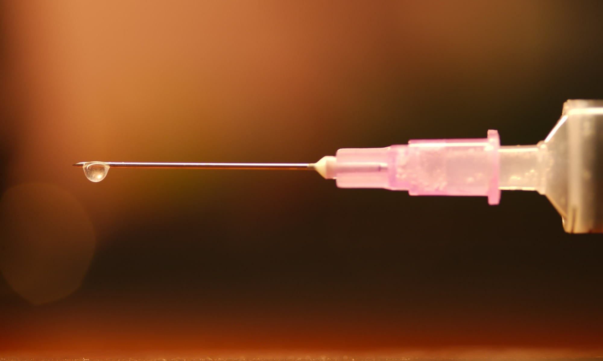 blue plastic tube with black string